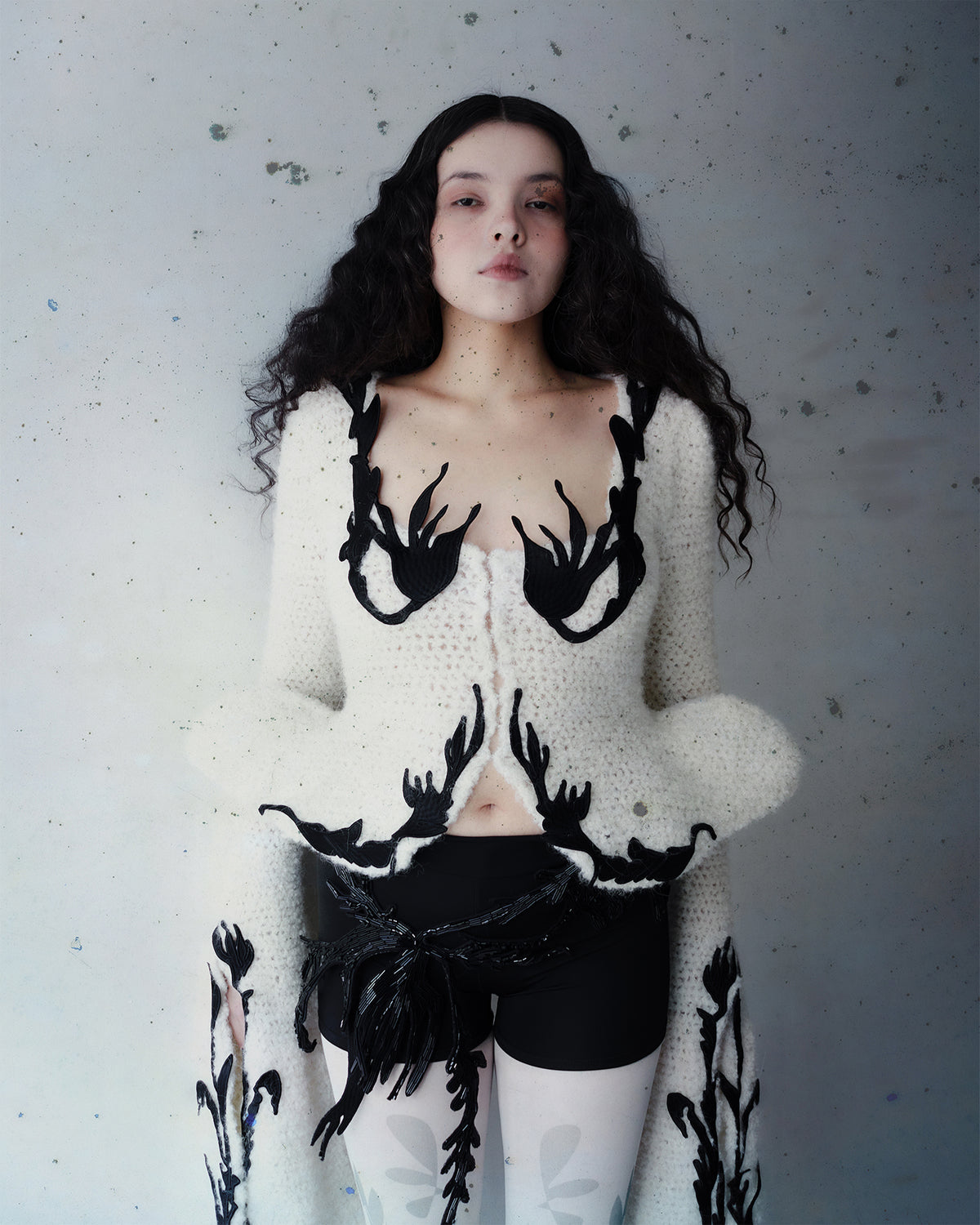 Crocheted cardigan with embroidery and hook closure