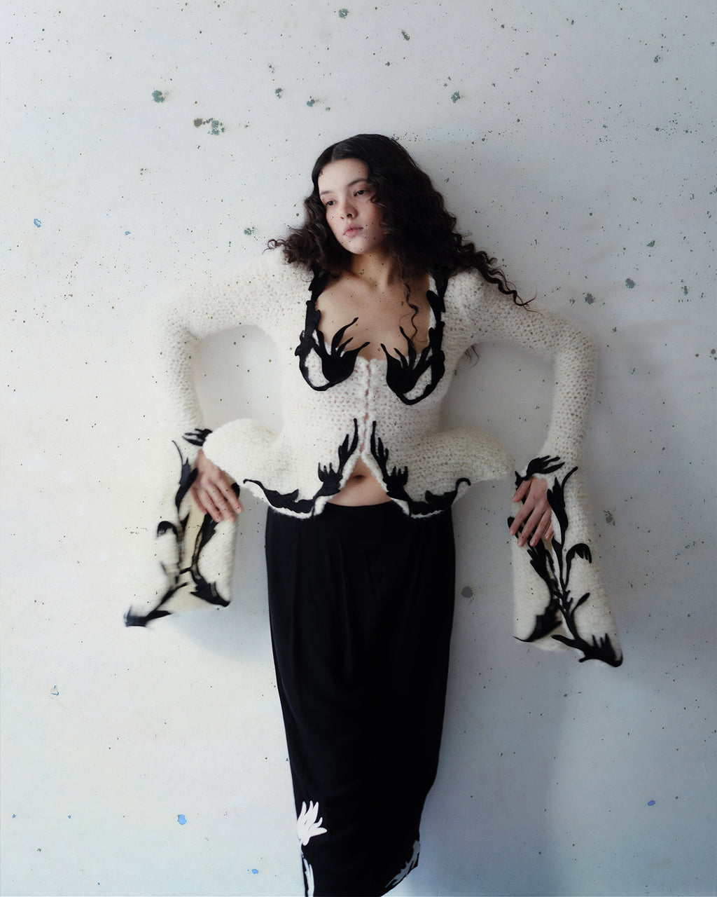 Crocheted cardigan with embroidery and hook closure