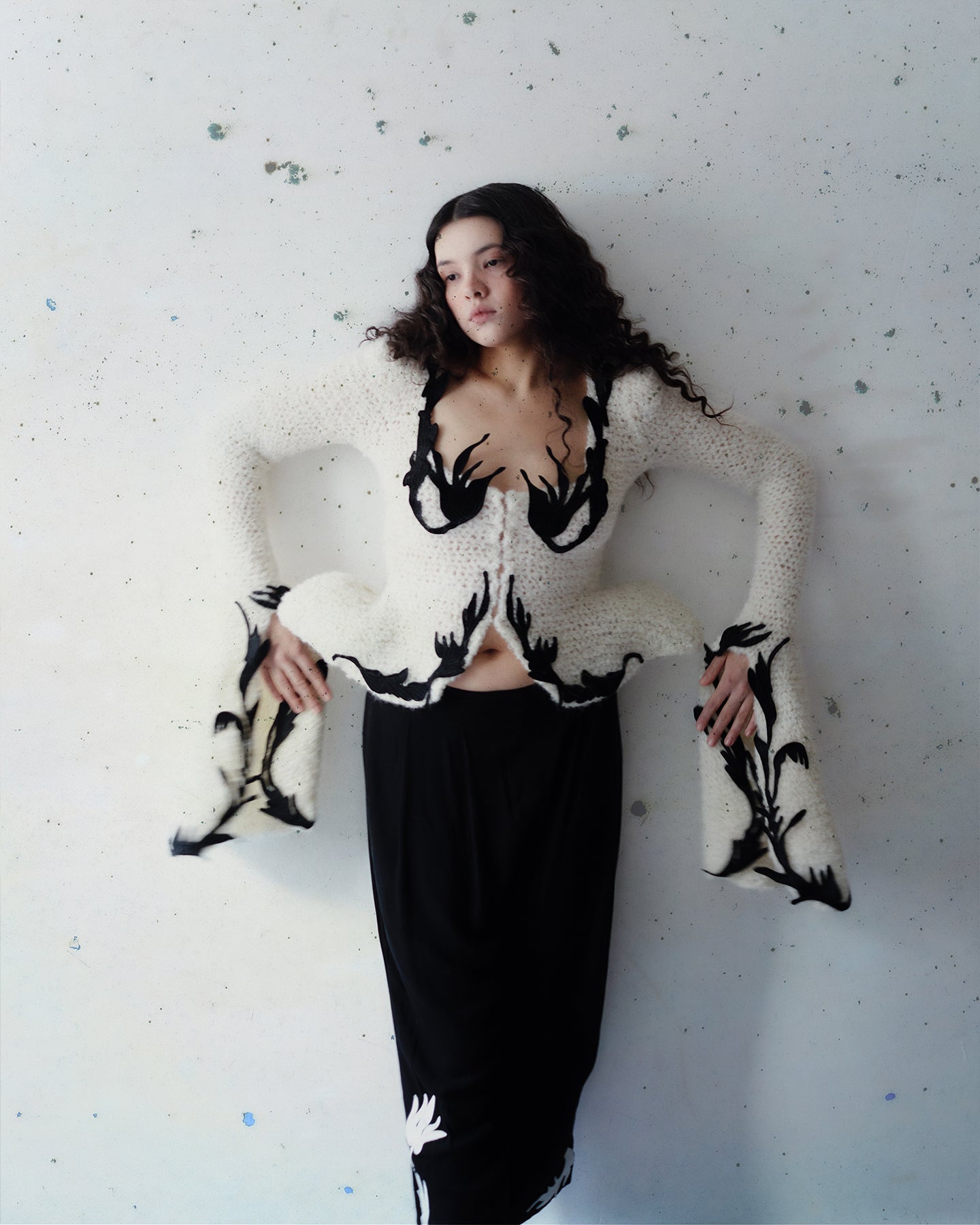 Crocheted cardigan with embroidery and hook closure