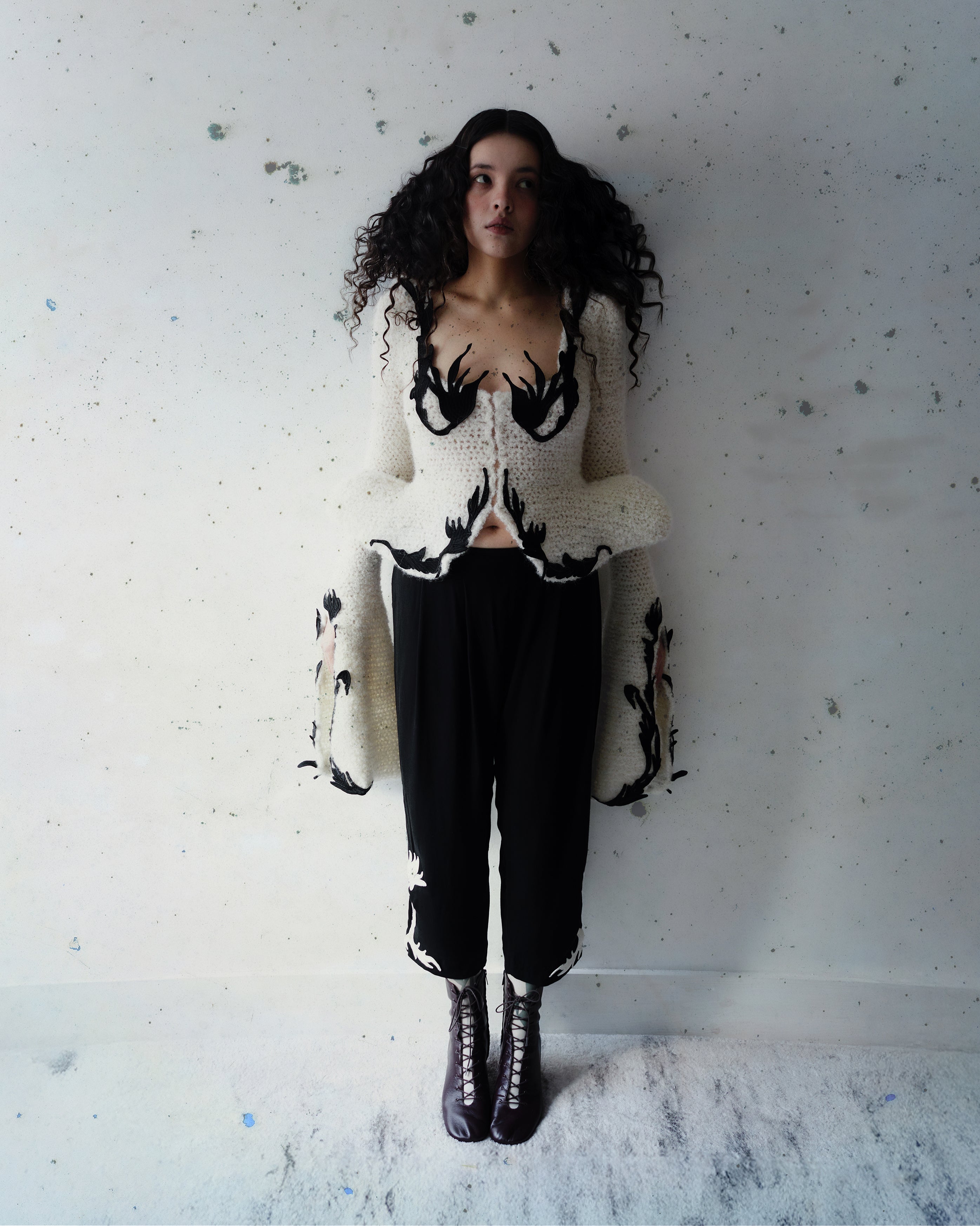 Crocheted cardigan with embroidery and hook closure