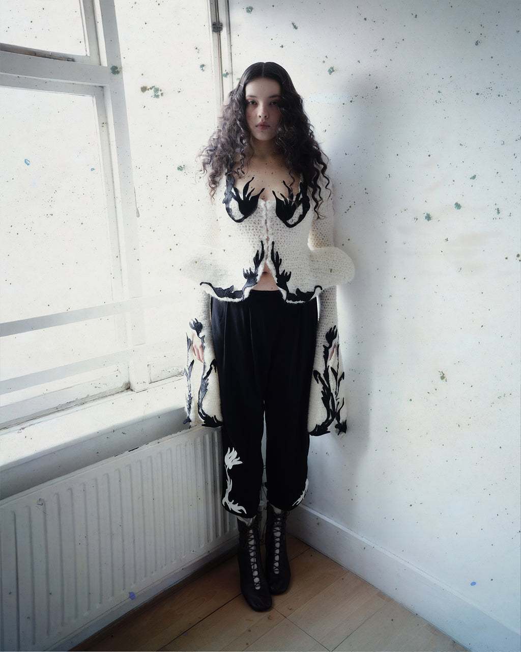Crocheted cardigan with embroidery and hook closure